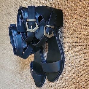 BUMPER black leather gladiator sandals, buckle accents. Size 8.